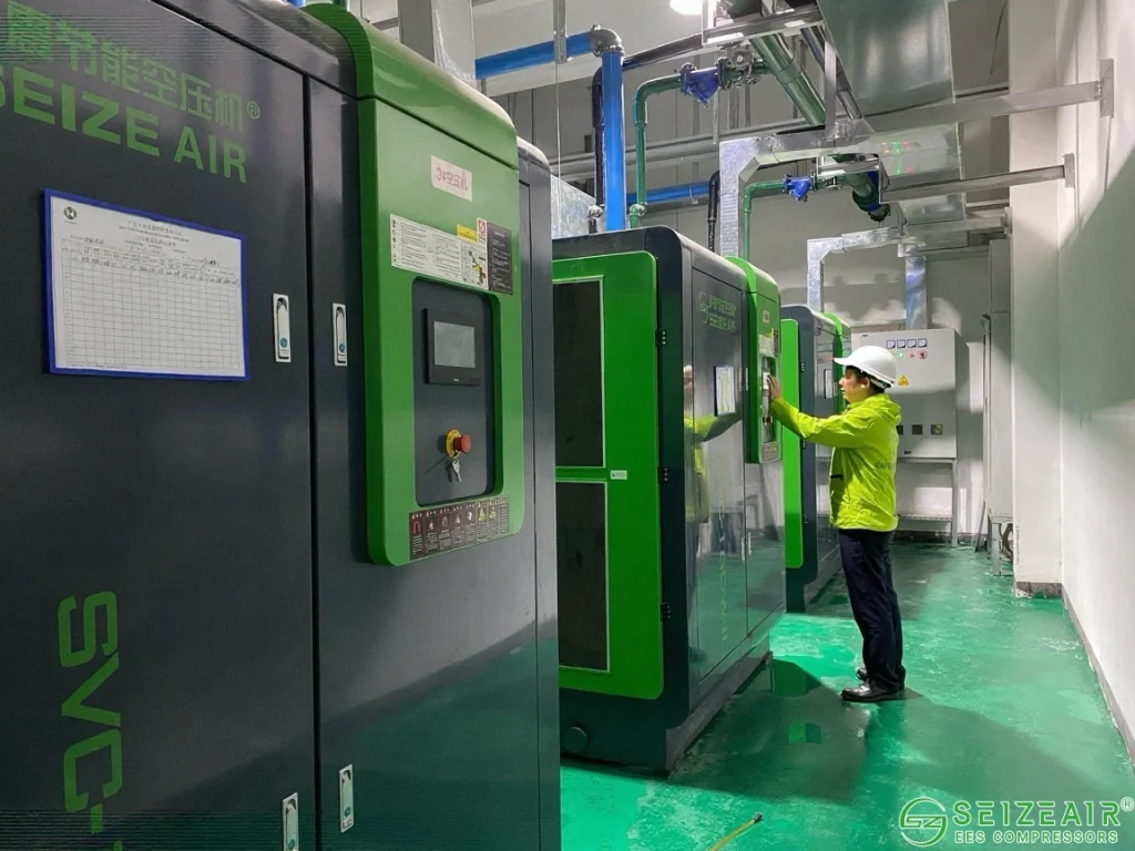 Engineer performing regular air compressor inspection