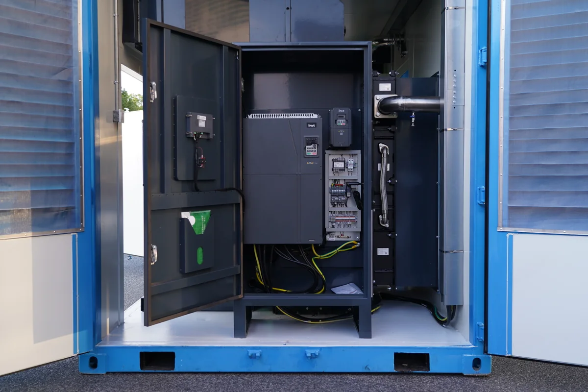 Variable speed drive panel with Danfoss drive and electrical protection inside a skid mounted air compressor station enclosure