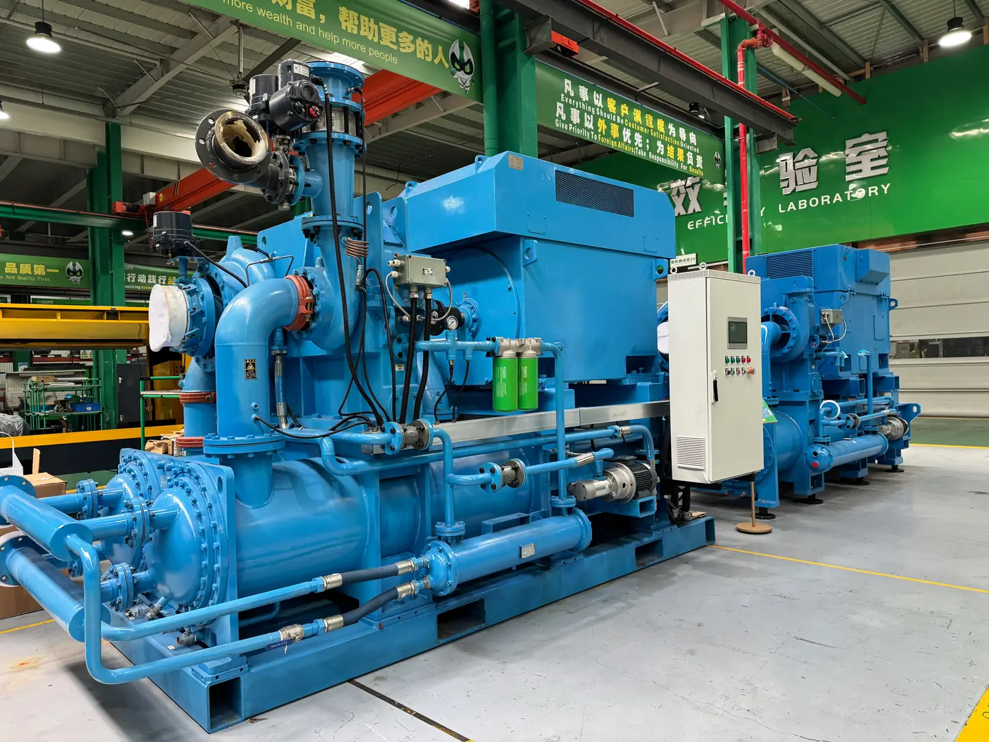 Geared centrifugal blower assembly with its casing and coupling visible